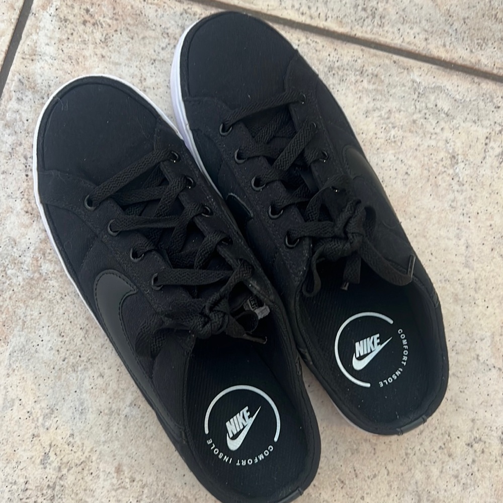 Black Nike slip-on tennis shoes. New.